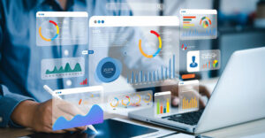 Business professional reviews sales and customer data dashboards to identify trends and opportunities.
